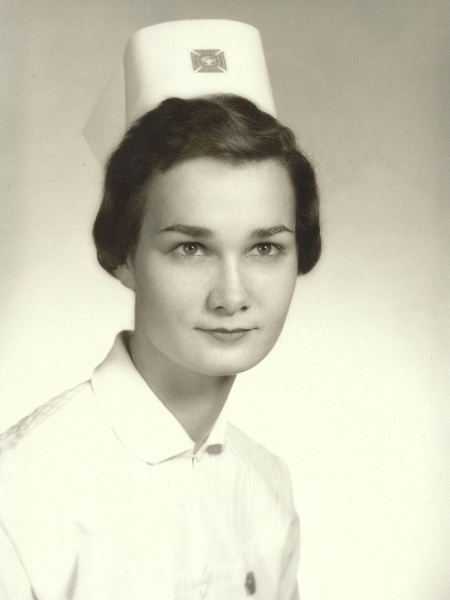 black and white photo of Martha Pitzer wearing a nurse uniform in 1959