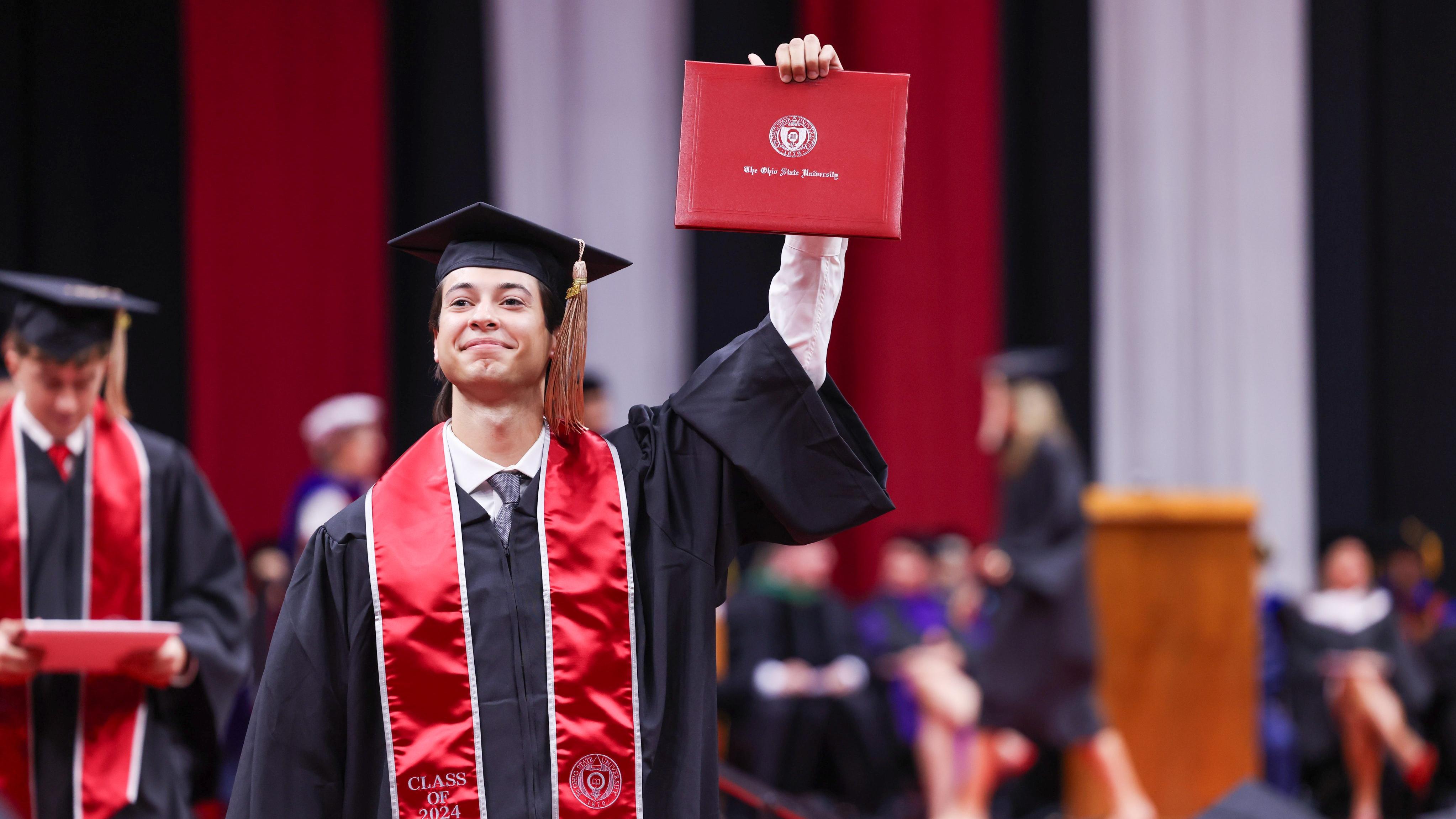2024 buckeye graduate raises diploma with one hand