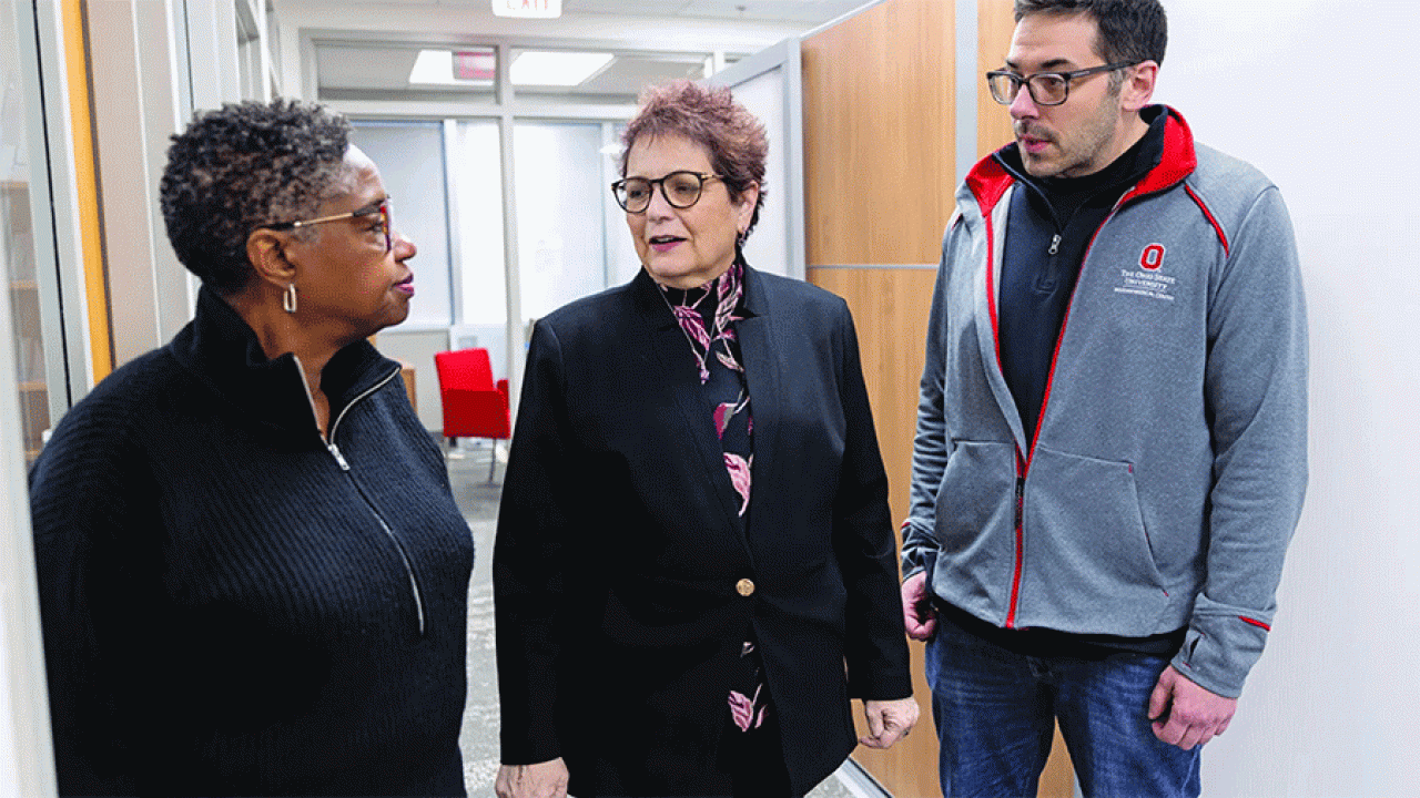Electra Paskett (center), Marion N. Rowley Chair in Cancer Research, chats with colleagues Cecilia DeGraffinreid and Ryan Baltic ’10 MPH. (Photo by Jodi Miller)