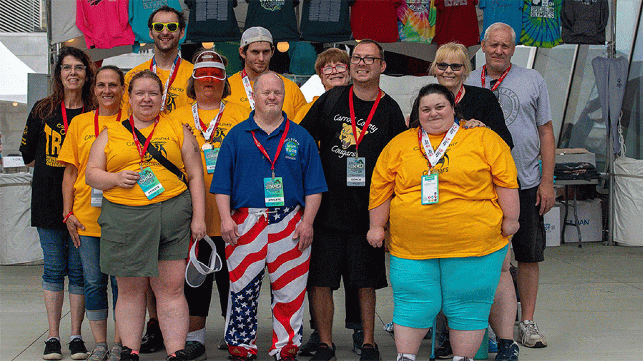 Special Olympics Ohio coach and former athlete, Brandon Hahn (center, black shirt), and the 2024 team from Carroll County.