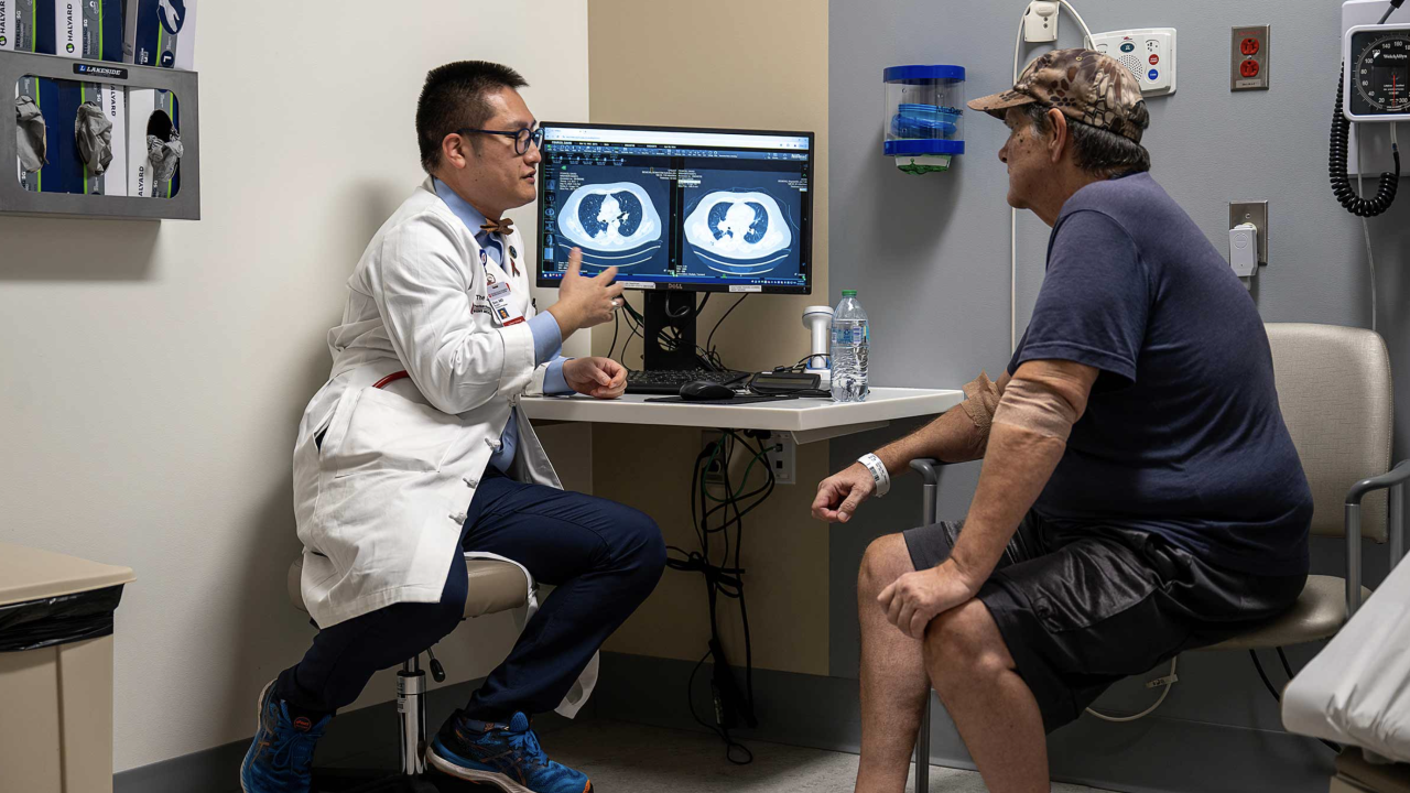 Mike Penrod talking to a doctor.